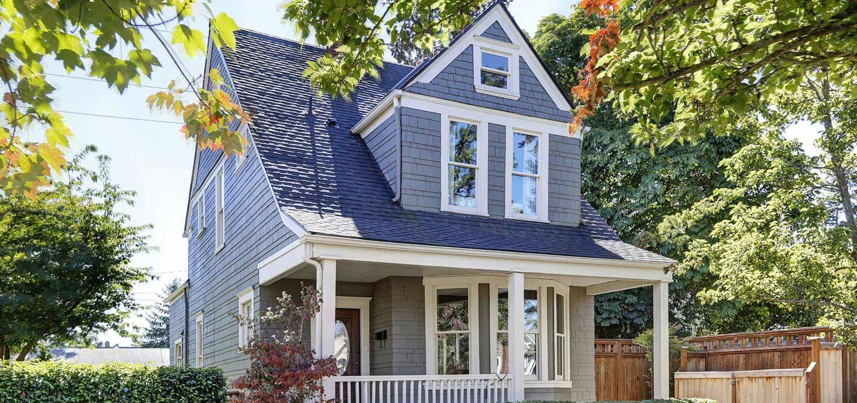 House with blue and grey siding - homepage hero